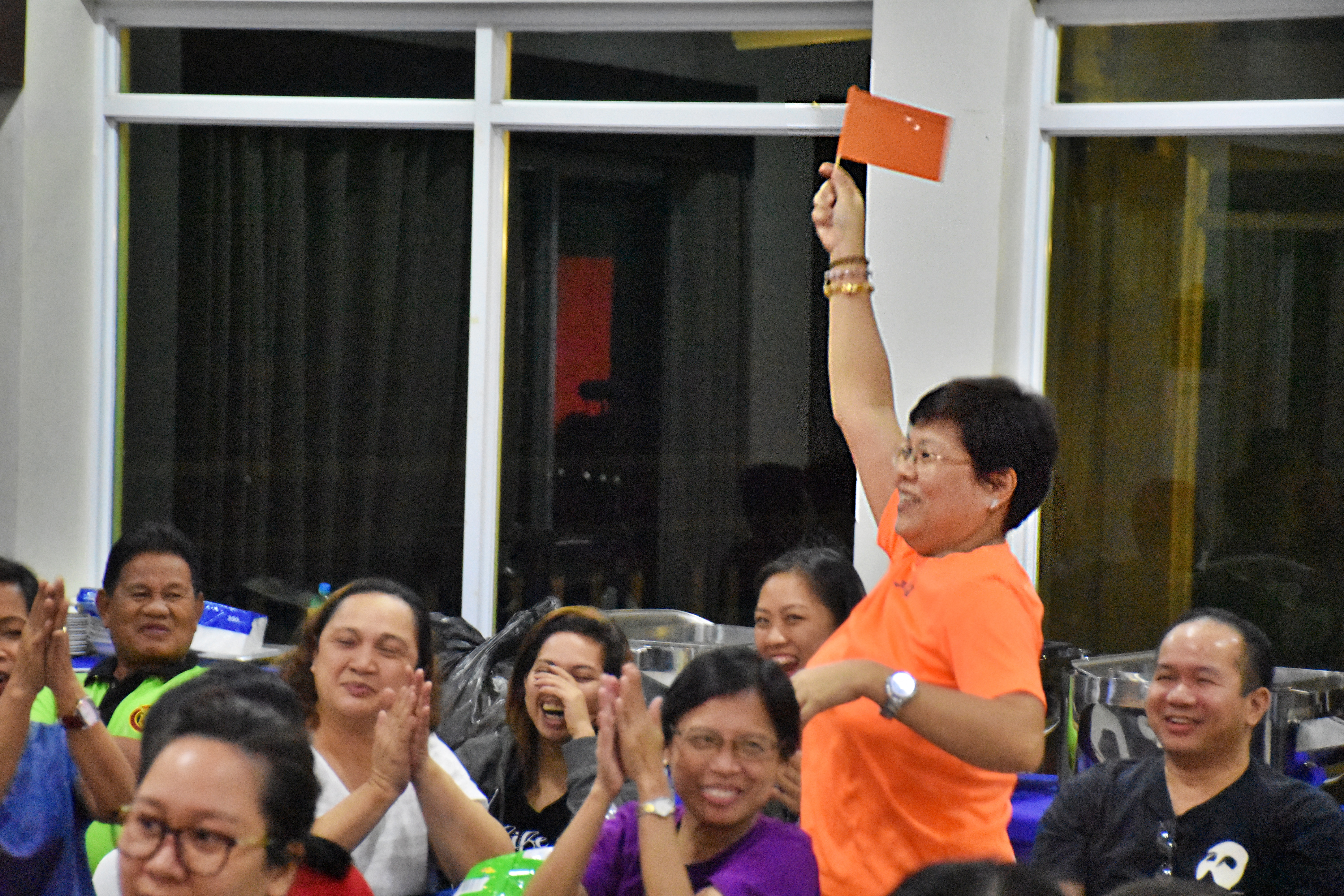 GEC Director Dr. Oyzon brightens up the competition with her sunny orange enthusiasm